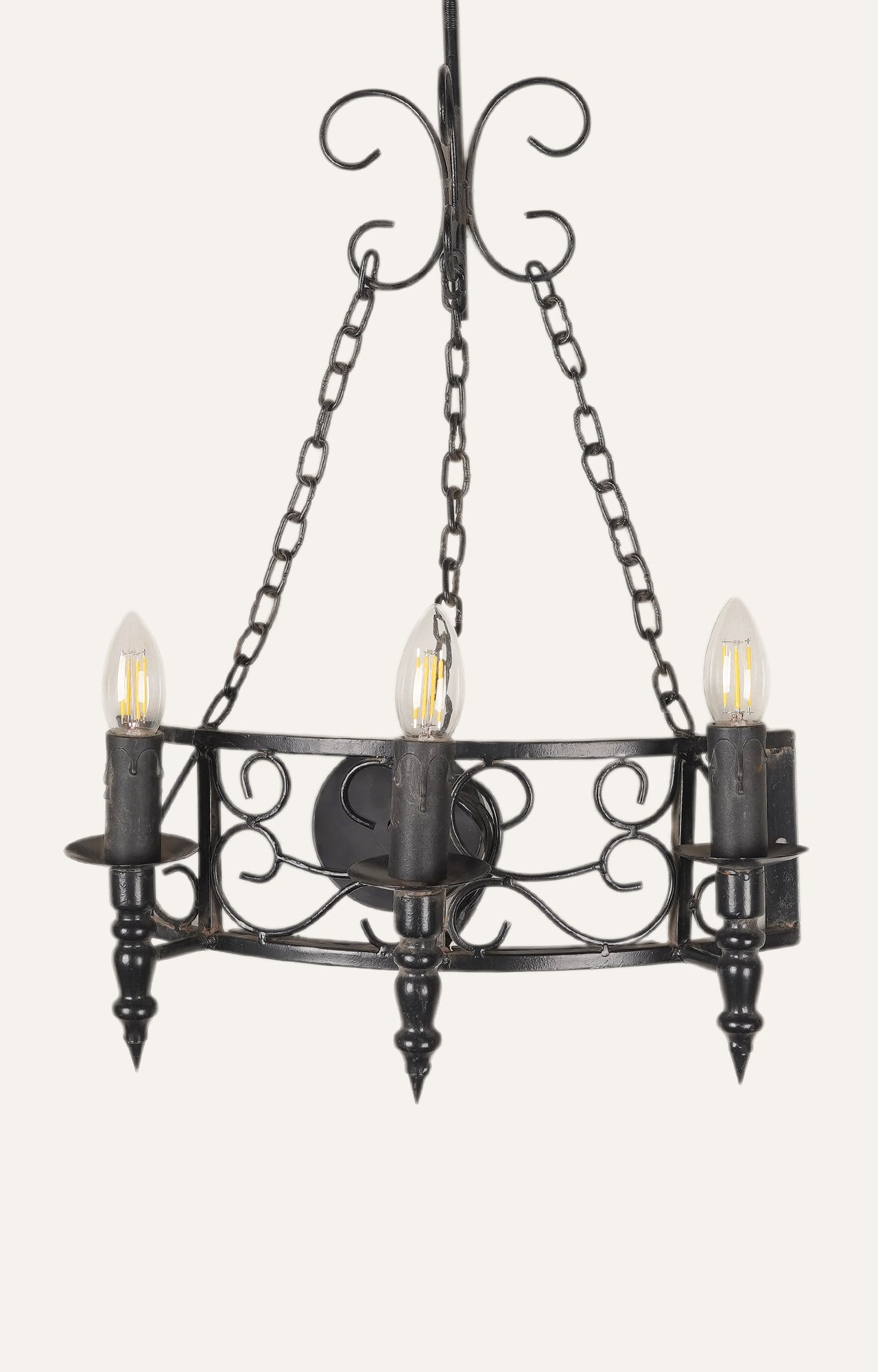 French-style black wall chandelier with three candle-style LED bulbs.