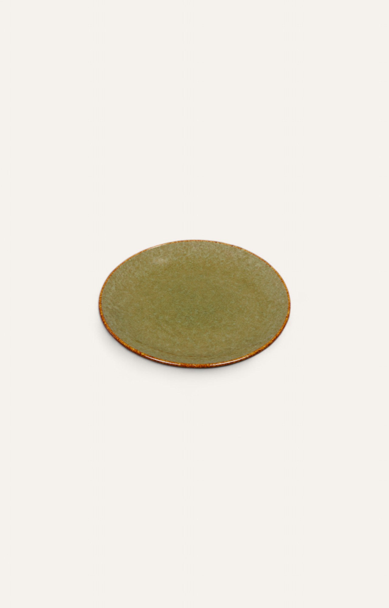 Round ceramic plate with olive glaze and burnt sienna rim