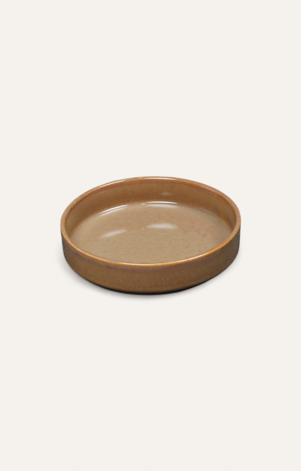 Low ceramic bowl in light brown caramel glaze