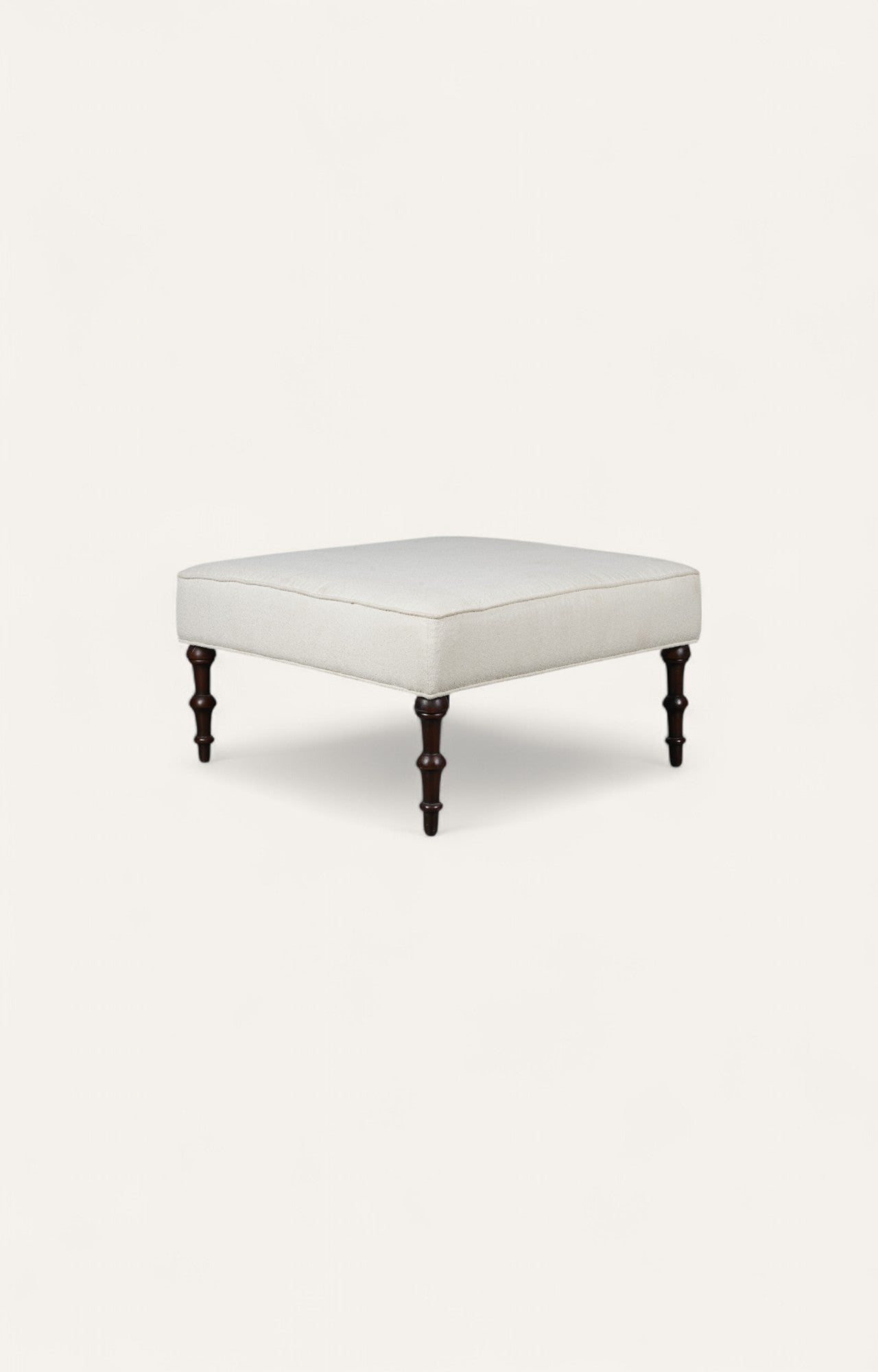 Traditional Ottoman with Cream Upholstery and Dark Turned Legs