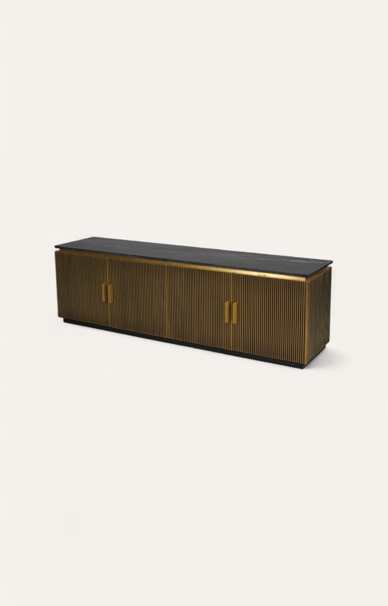 Long brass TV console with marble top and vertical fluted detailing