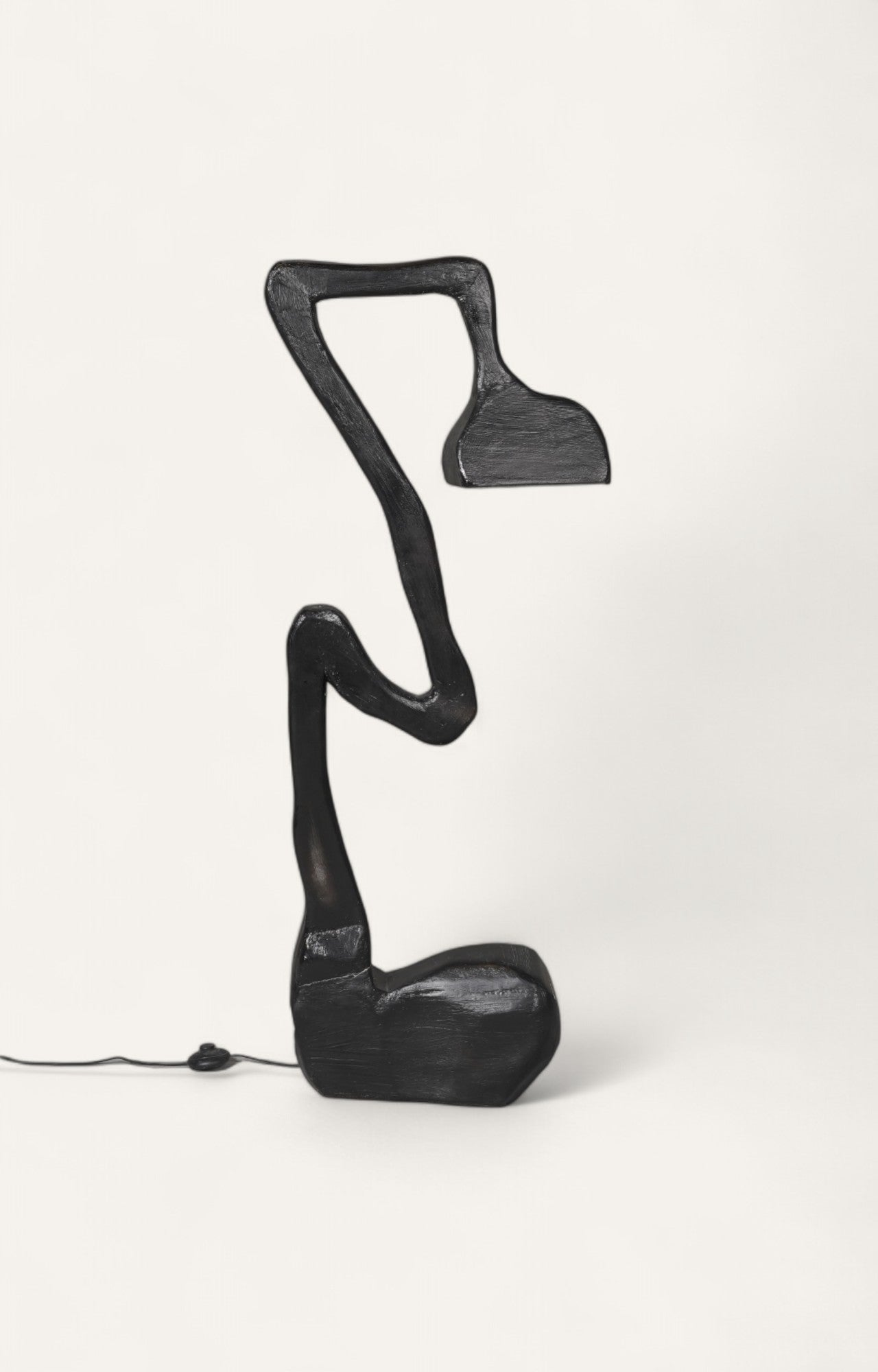 Modern sculptural floor lamp in black finish with mushroom-inspired wooden base.