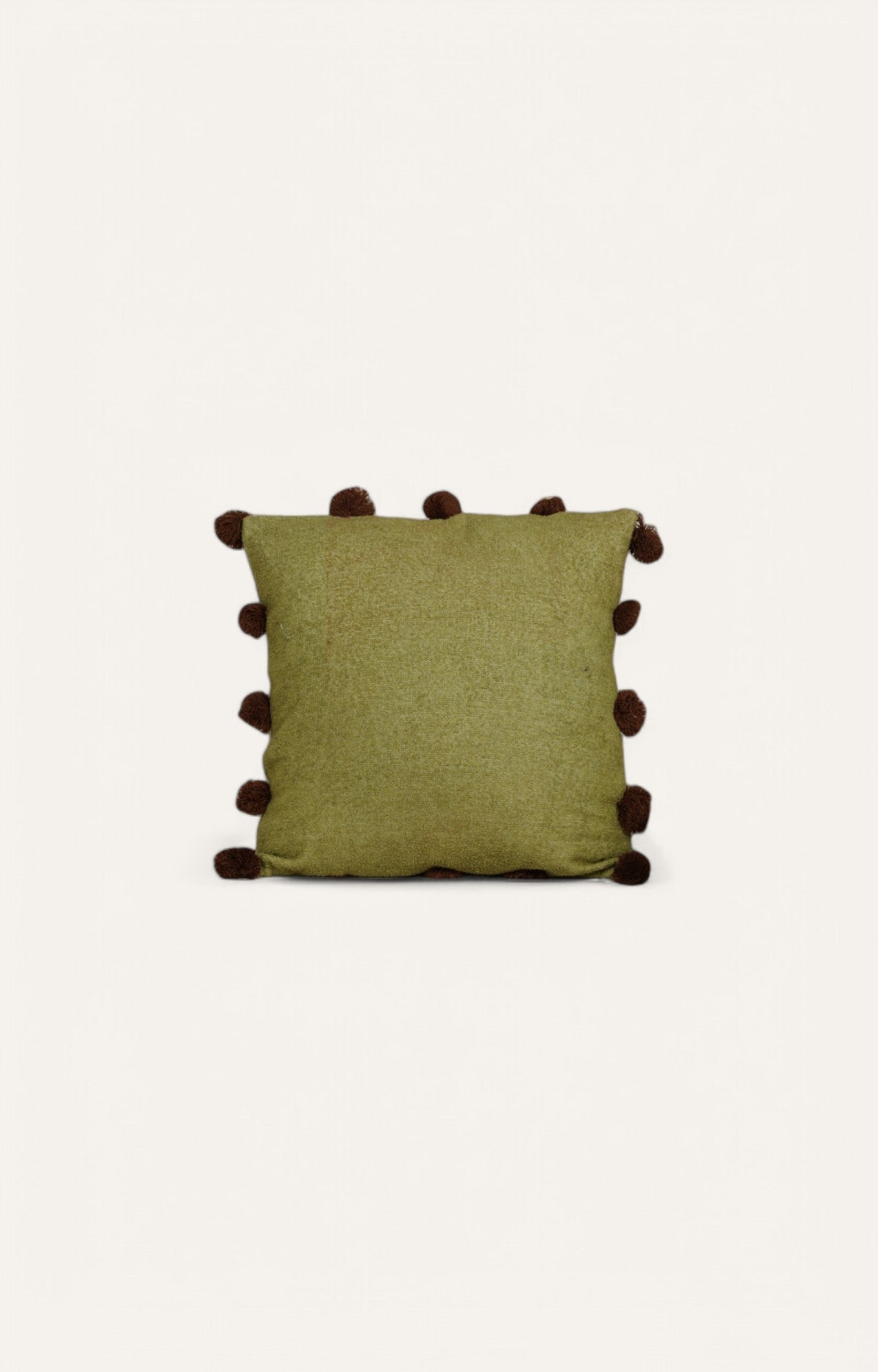 This Green Textured Cushion with Pom-Pom Detailing