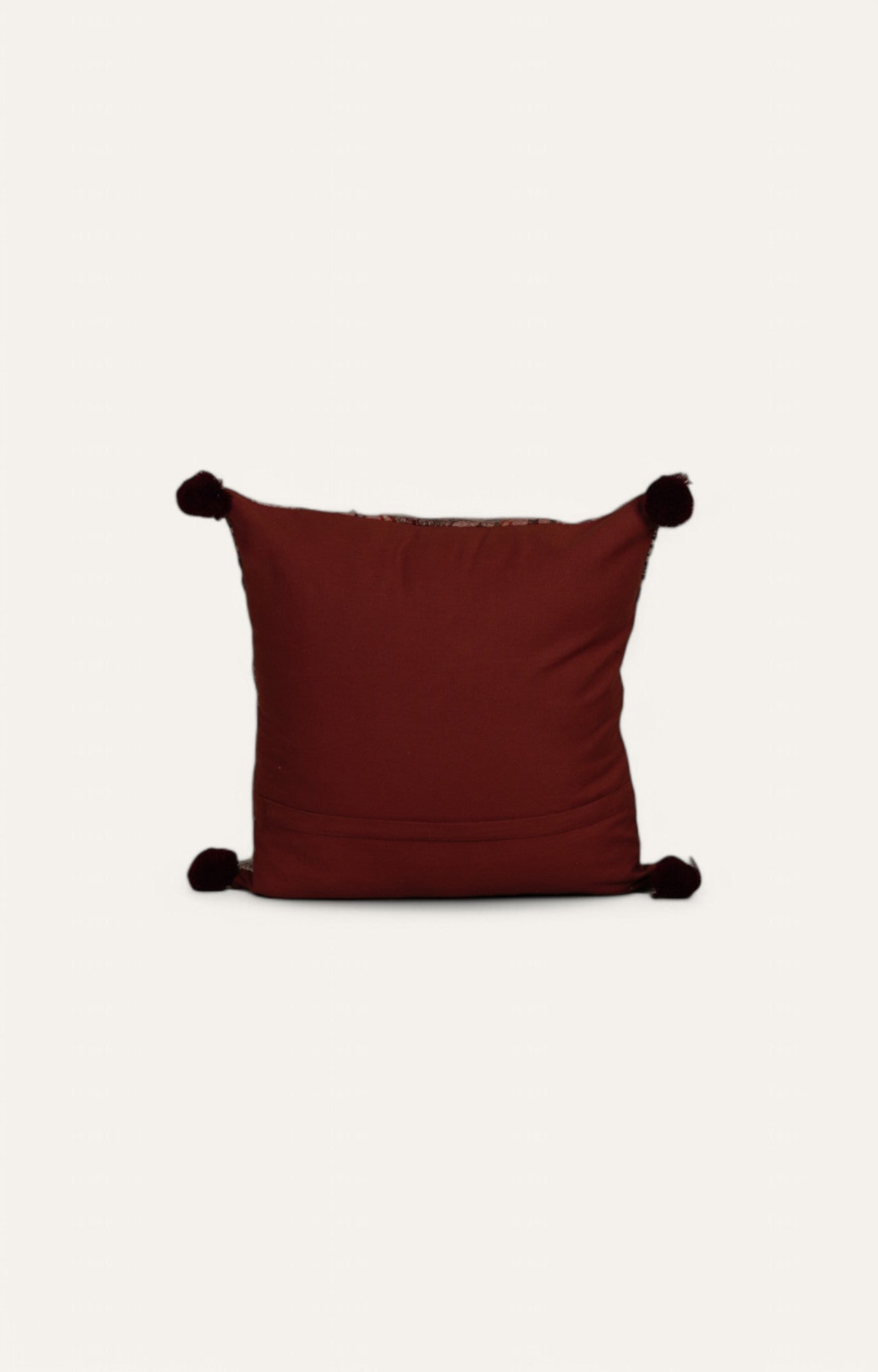 Intricate Patterned Cushion with Pom-Pom Accents