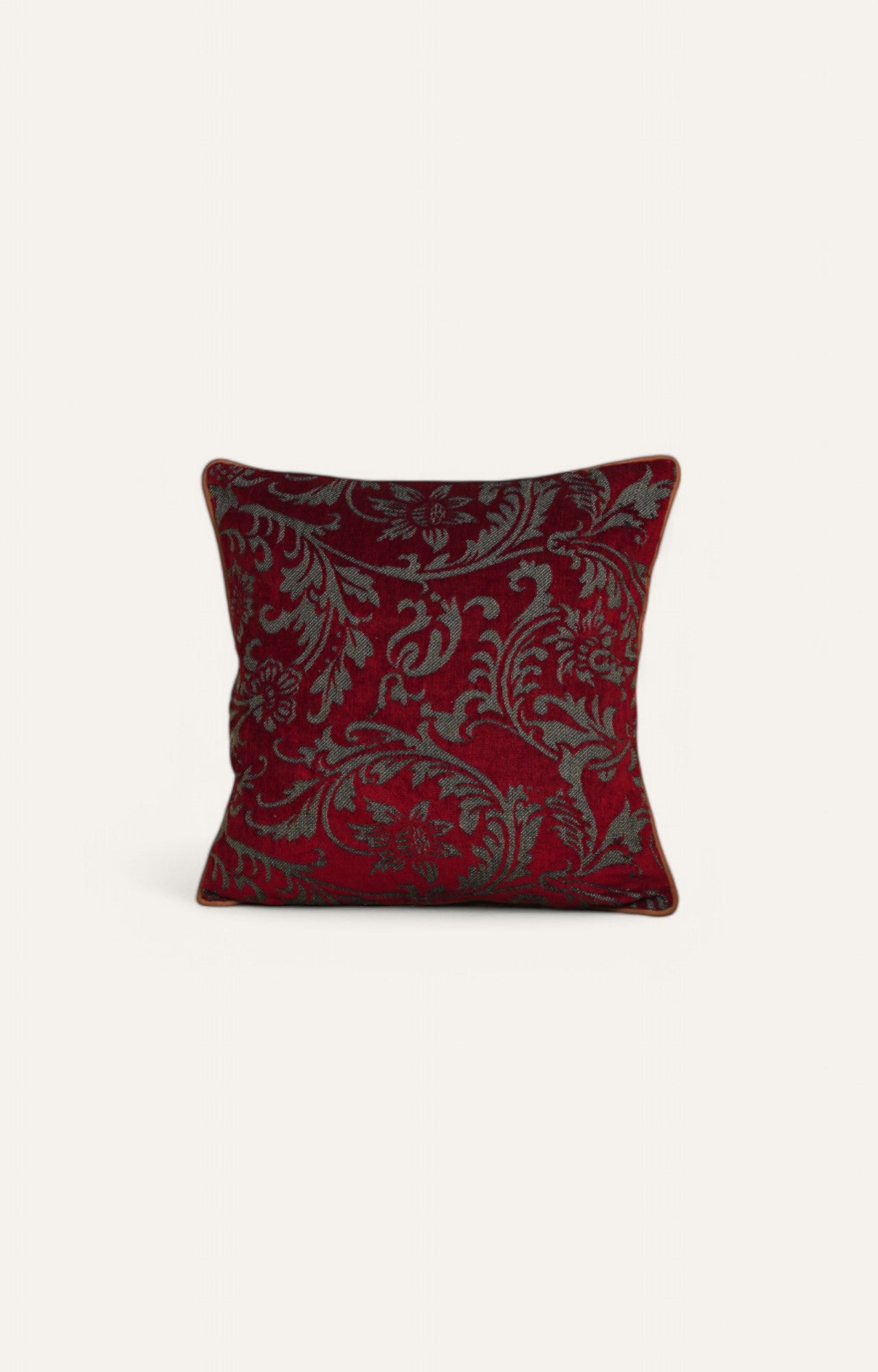 Red Cushion with Intricate Floral Pattern