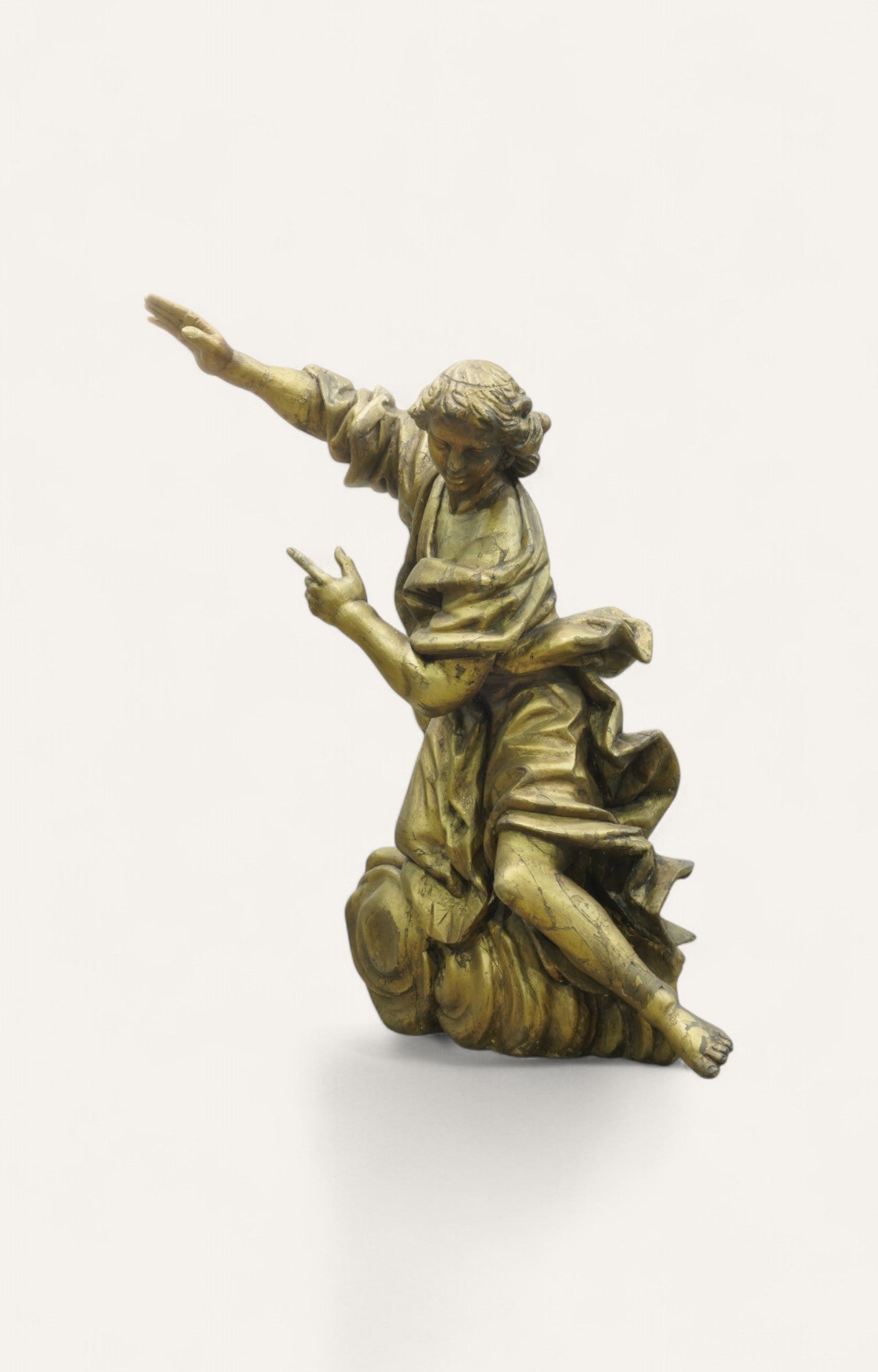 Large Baroque-style kneeling angel sculpture in gilded wood