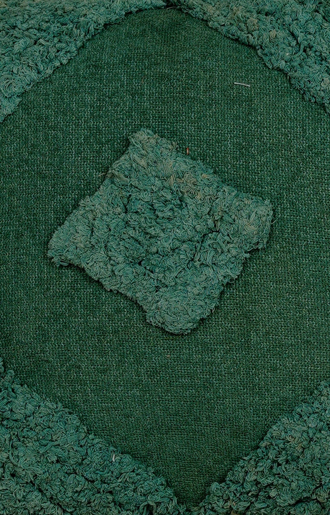 Green Tufted Cushion with Tassel Detailing