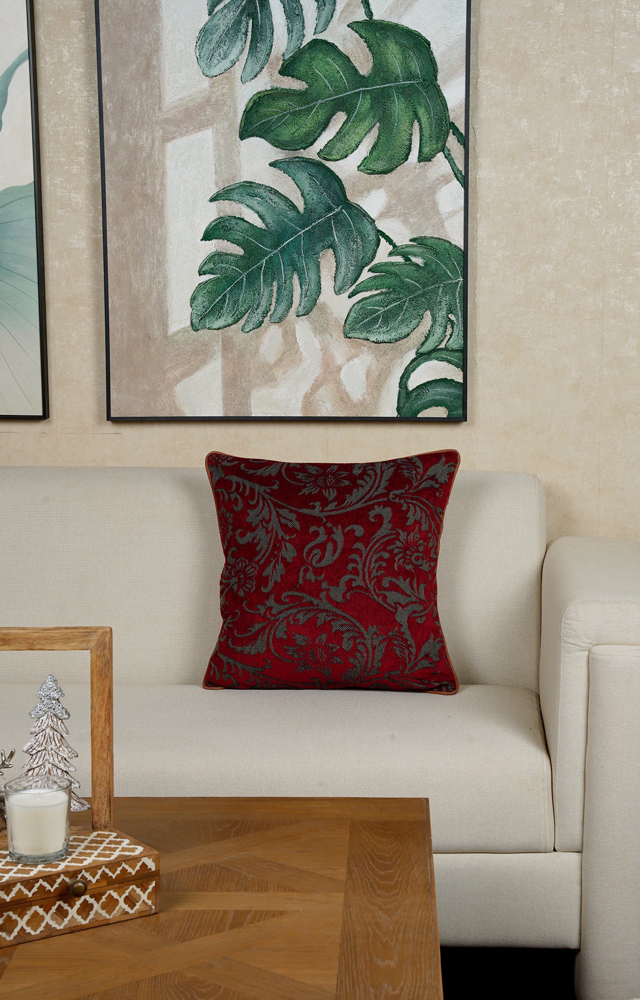 Red Cushion with Intricate Floral Pattern