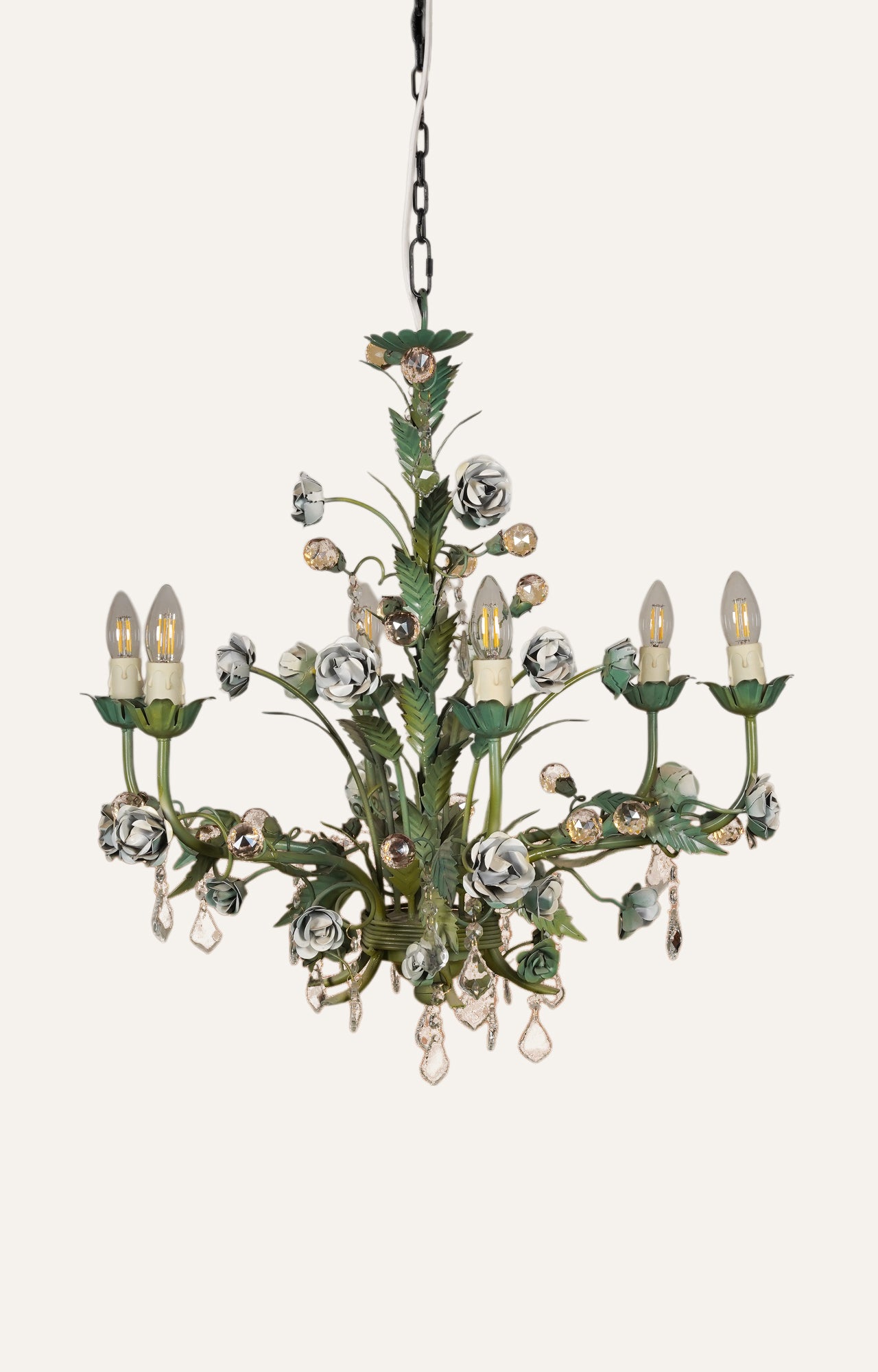  Leafy floral chandelier in rustic patina finish with metal and crystal details.