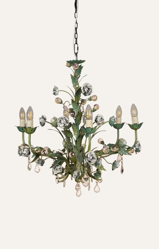 Leafy floral chandelier in rustic patina finish with metal and crystal details.