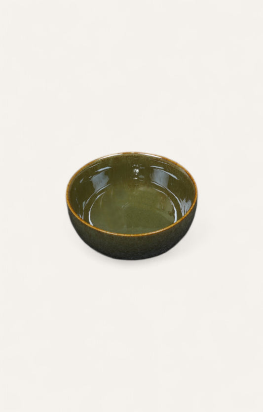 Olive green glazed ceramic serving bowl with brown rim