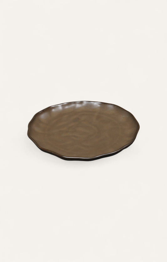 Sand brown ceramic plate with smooth glaze and ripple edges