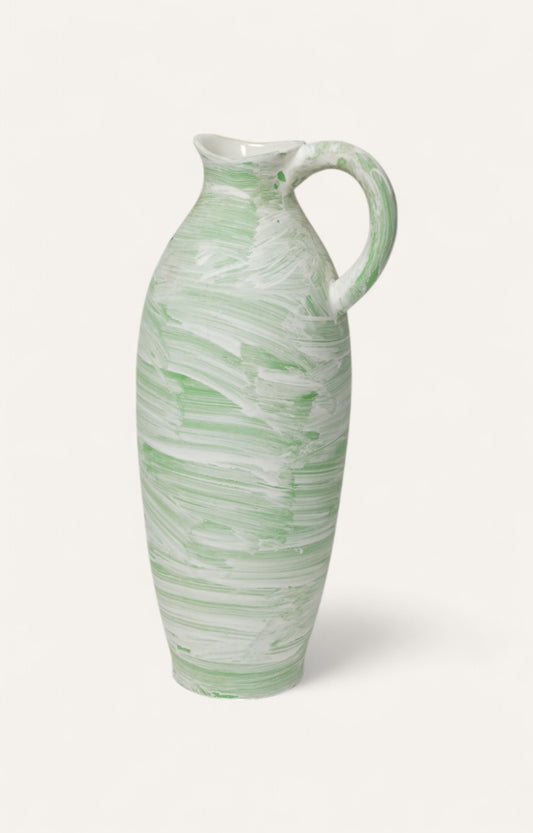 Tall ceramic jug in mint and white swirl finish with curved handle