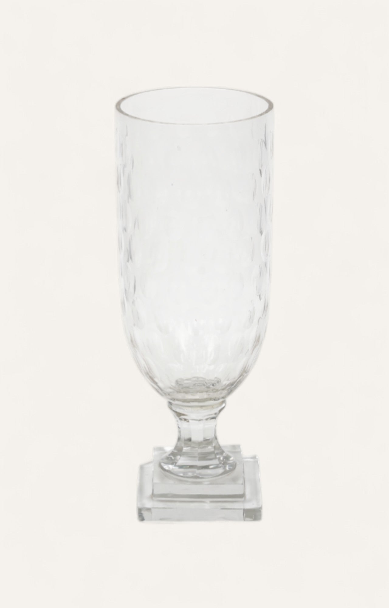  Tall hammered glass candle stand on a clear square base
