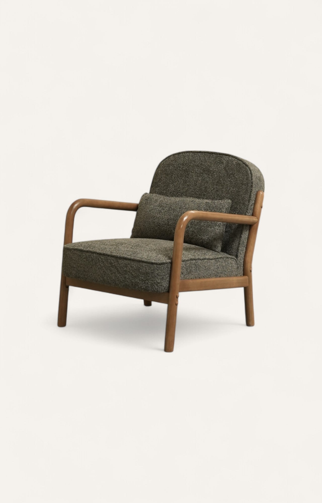Bouclé armchair with curved wooden arms and matching cushion 