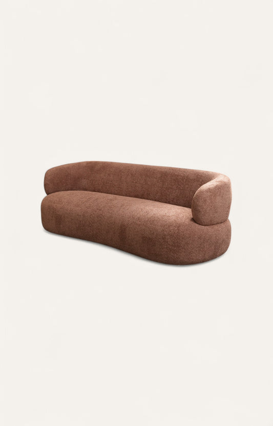 Bouclé curved sofa with sculptural back and smooth upholstery