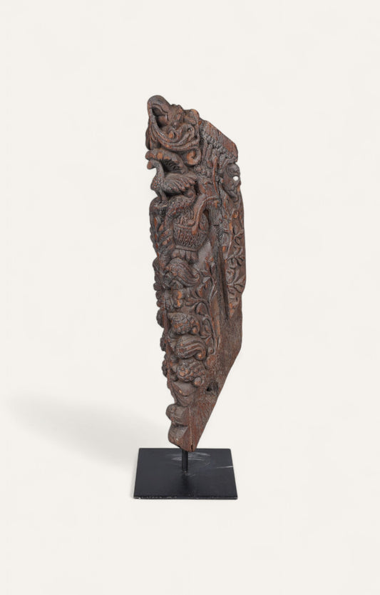 Teak wood carved architectural column fragment on black iron base