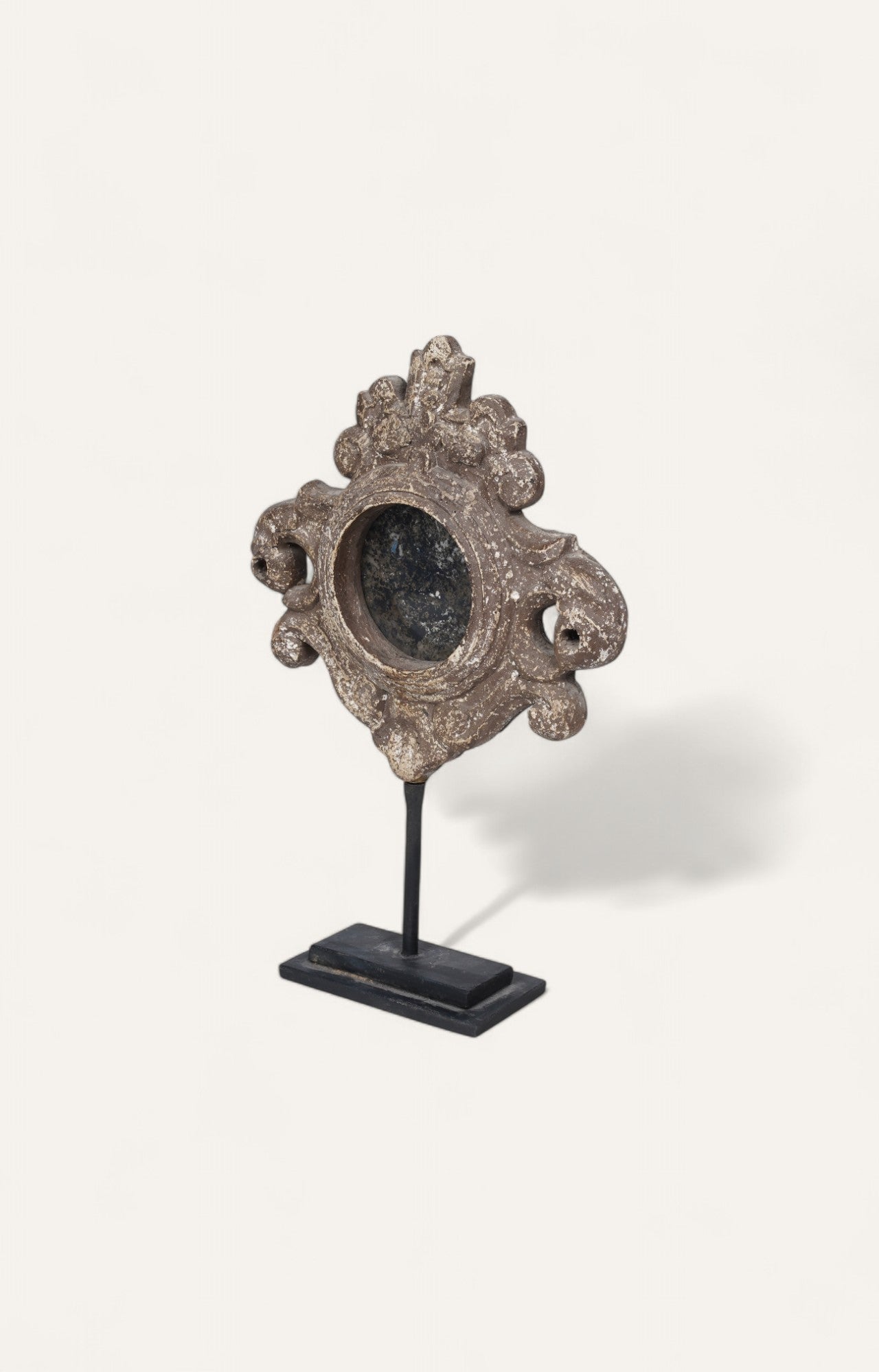 French-style carved mirror frame fragment with antique patina on stand
