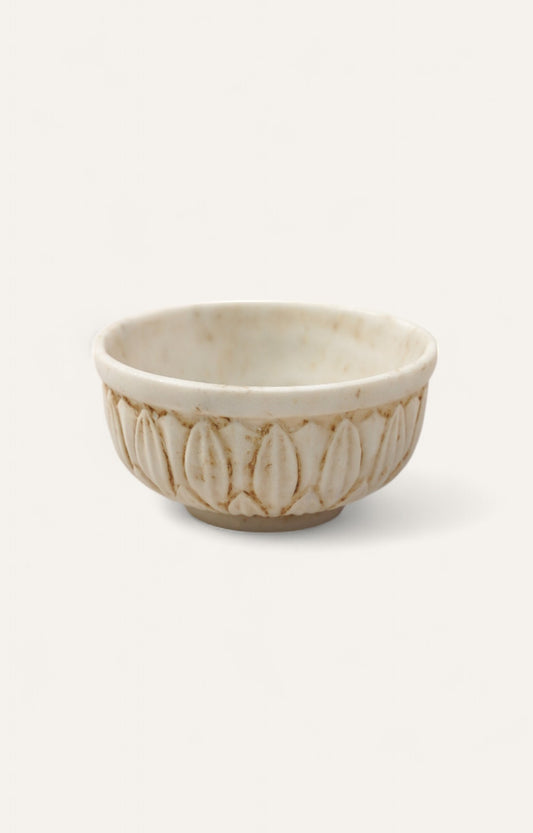  Low white marble bowl with carved floral motif 