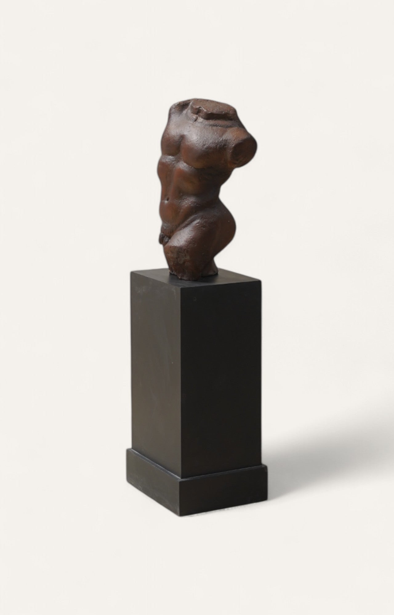 Burnt umber cement torso sculpture with iron base 