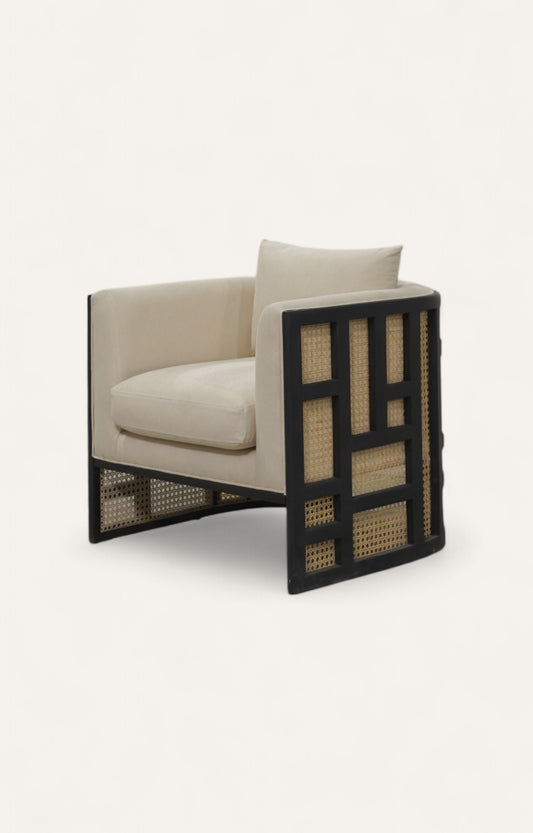 Arm sofa chair with black acacia frame, cane paneling and linen cushions