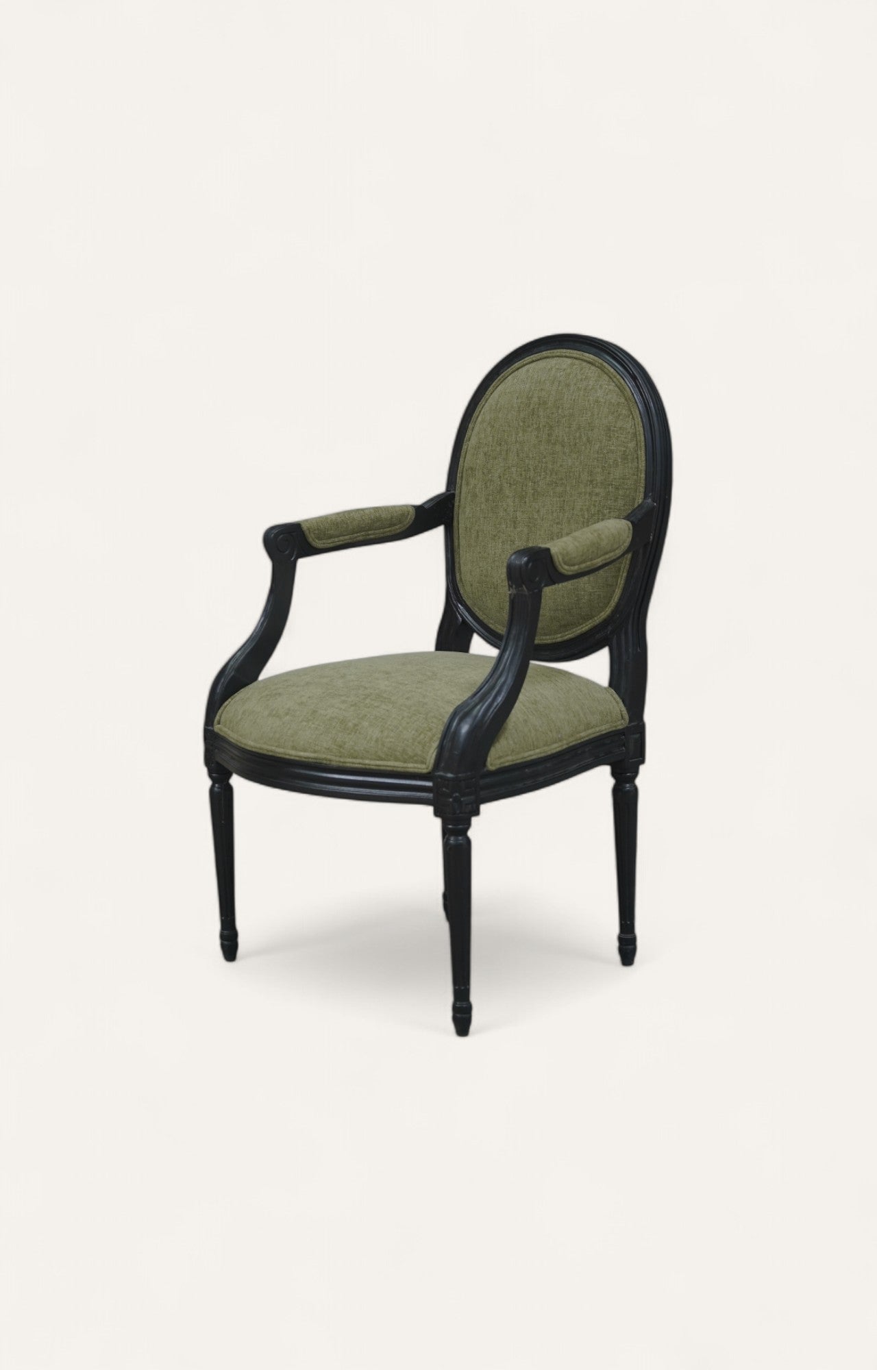 Black French-style carved armchair with green poly velvet upholstery