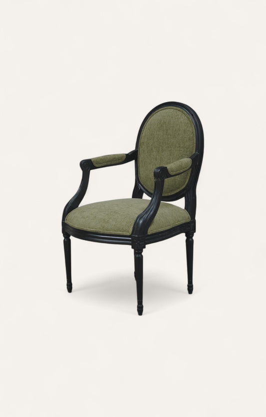 Black French-style carved armchair with green poly velvet upholstery