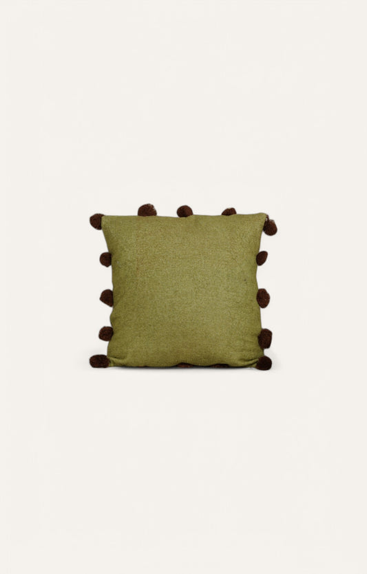 This Green Textured Cushion with Pom-Pom Detailing