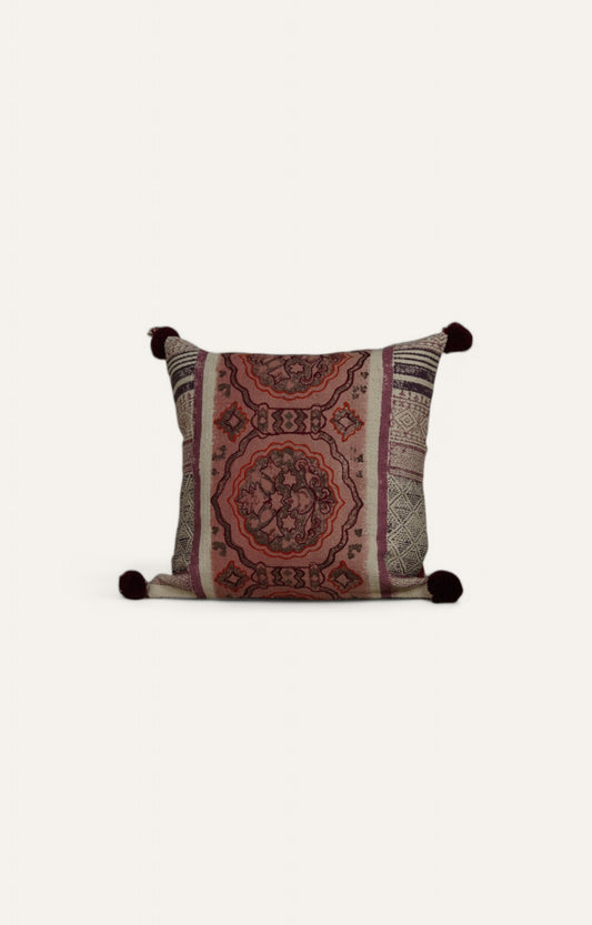 Intricate Patterned Cushion with Pom-Pom Accents