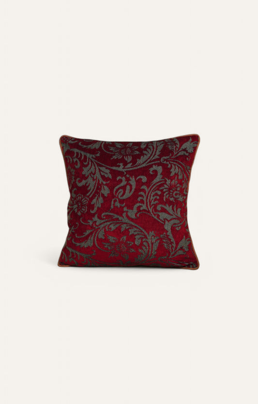 Red Cushion with Intricate Floral Pattern