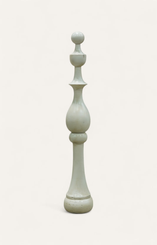 Tall sculptural pillar in whitewashed acacia wood with tiered geometric form.