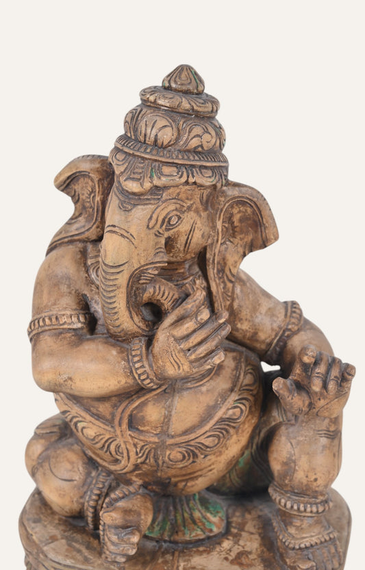 Hand-carved Ganesha Sculpture in Seated Posture