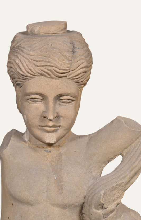 Man with Fish Stone Sculpture