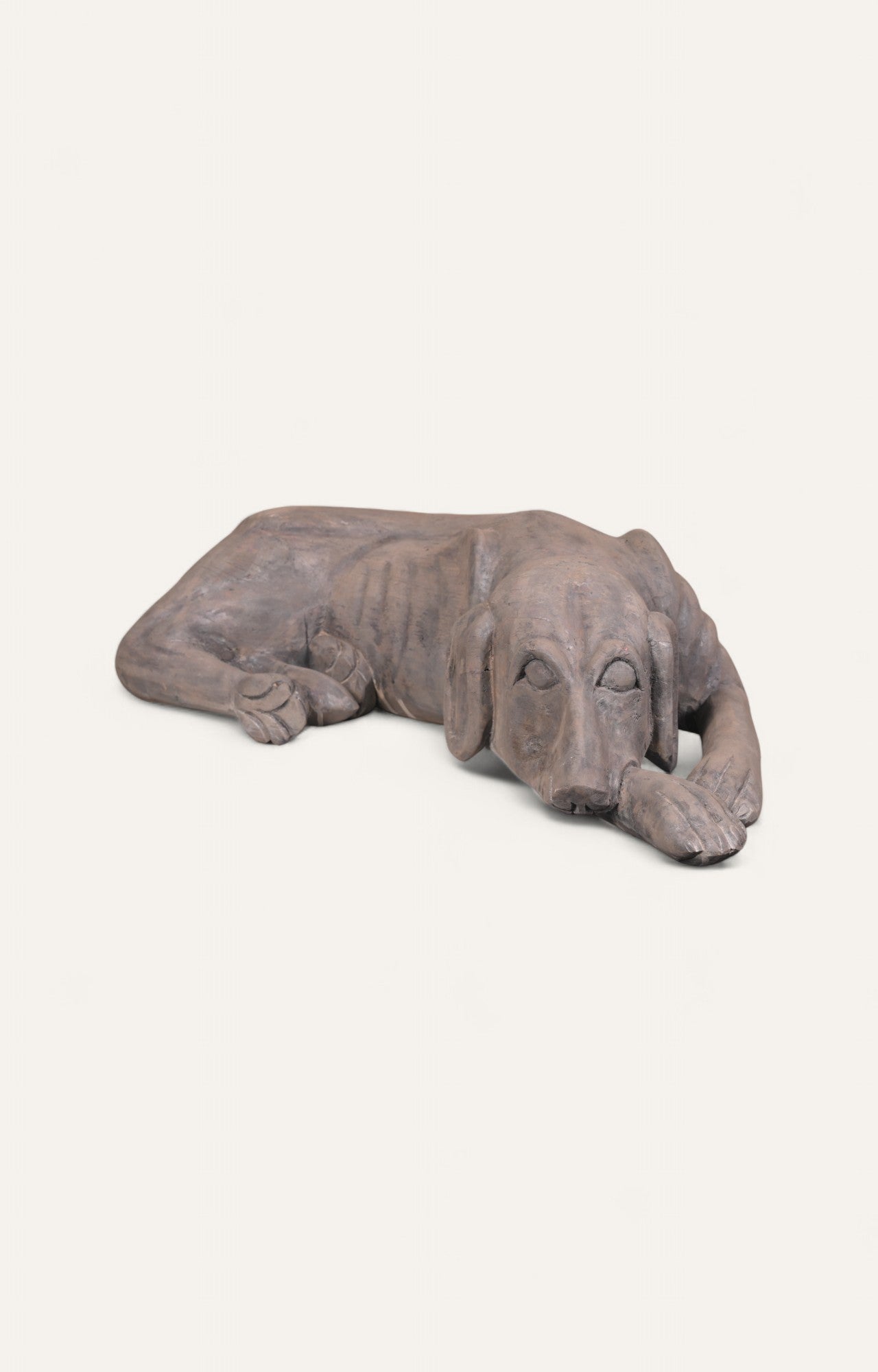 Sleeping dog sculpture hand-carved from teak wood