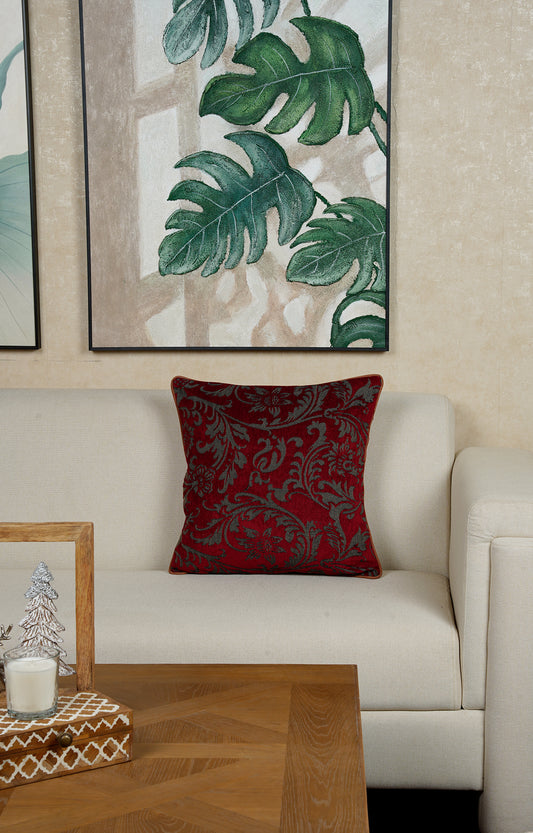 Red Cushion with Intricate Floral Pattern