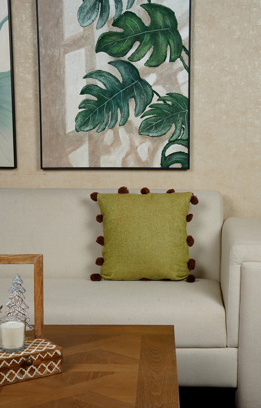 This Green Textured Cushion with Pom-Pom Detailing